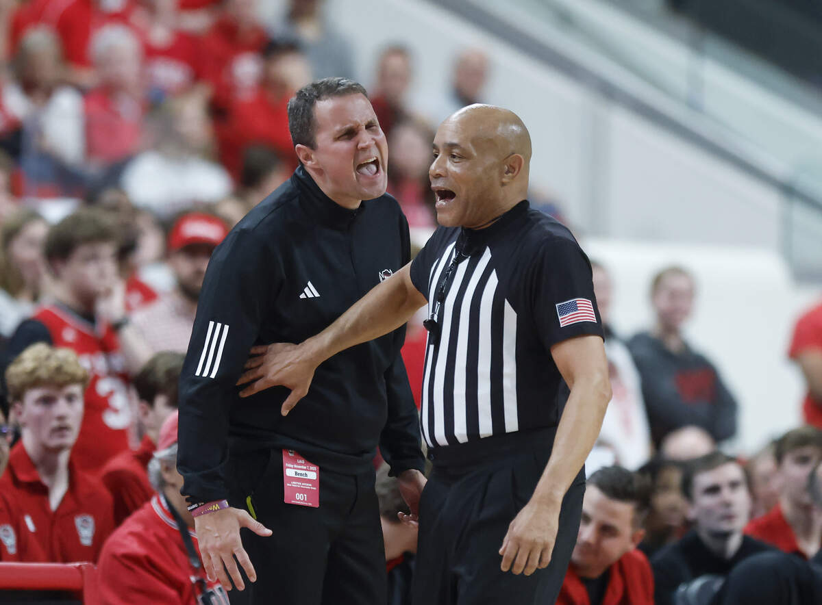 N.C. State head coach Will Wade speaks with an official during the first half of the Wolfpack’s game against UAB at Lenovo Center on Friday, Nov. 7, 2025, in Raleigh, North Carolina.