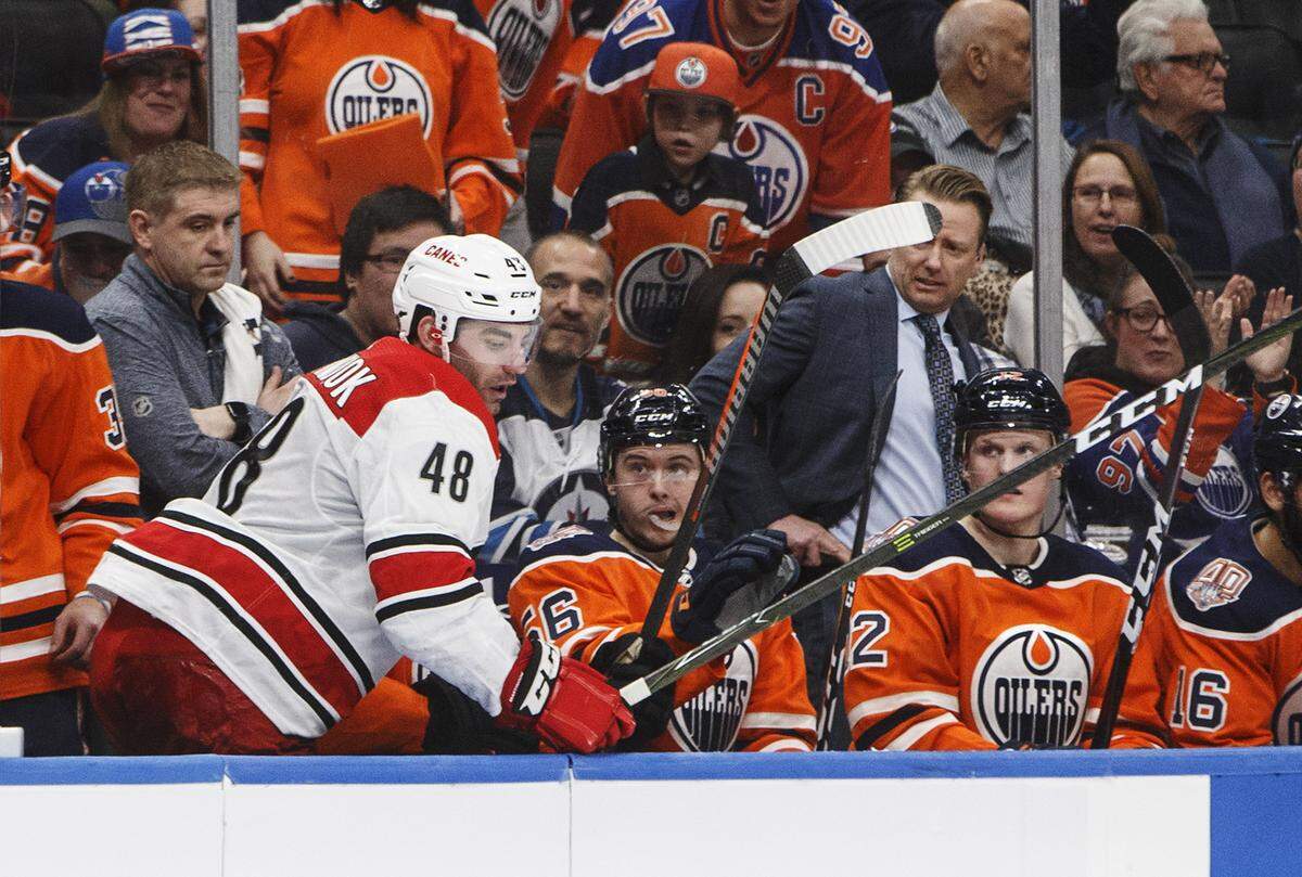Carolina Hurricanes’ Jordan Martinook (48) steps out of the the Edmonton Oilers bench after getting hit during the second period of an NHL hockey game in Edmonton, Alberta, Sunday, Jan. 20, 2019. (Jason Franson/The Canadian Press via AP)