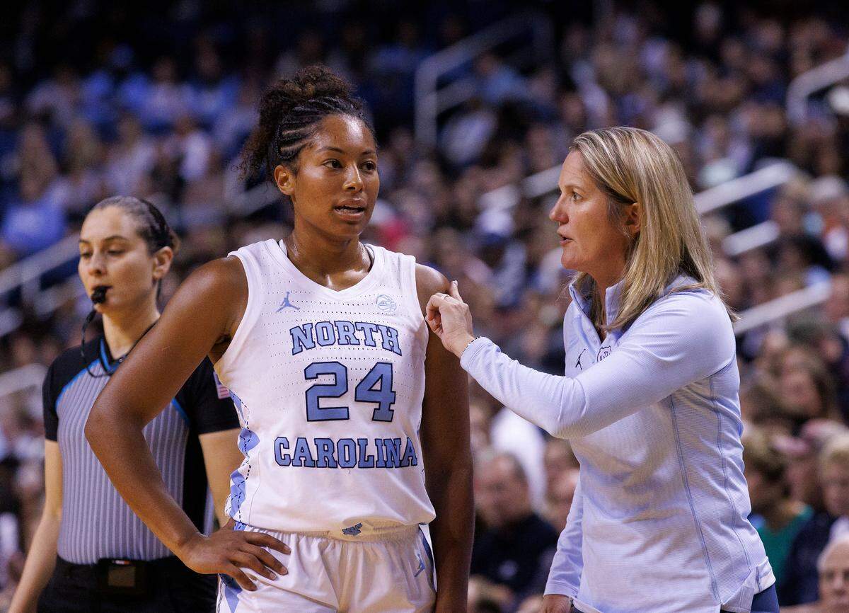 North Carolina head coach Courtney Banghart talks with Indya Nivar during the second half of the Tar Heels’ 69-58 loss to UConn on Friday, Nov. 15, 2024, at First Horizon Coliseum in Greensboro, N.C.