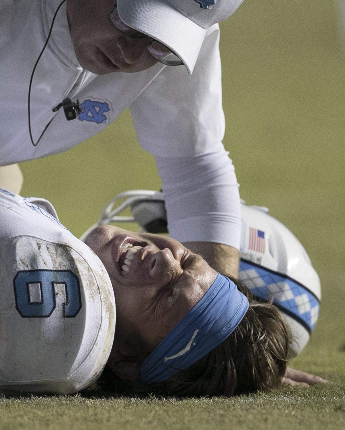 North Carolina quarterback Cade Fortin (6) grimaces in pain as he attended to following a hit in the second quarter against Virginia Tech on Saturday, October 13, 2018 at Kenan Stadium in Chapel Hill, N.C.