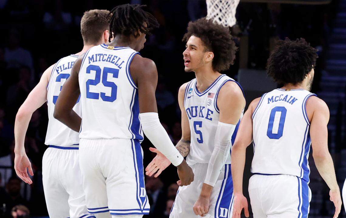 Duke’s Tyrese Proctor (5) celebrates with Mark Mitchell (25) during the first half of Duke’s game against Vermont in the first round of the NCAA Tournament at the Barclays Center in Brooklyn, N.Y., Friday, March 22, 2024.