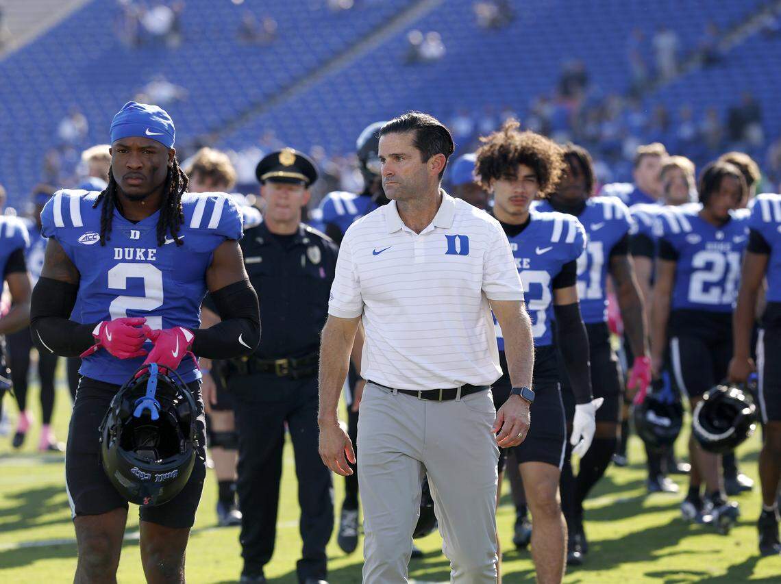 Duke head coach Manny Diaz walks off the field with his team following the Blue Devils’ 27-18 loss to Georgia Tech on Saturday, Oct. 18, 2025, at Wallace Wade Stadium in Durham, N.C.