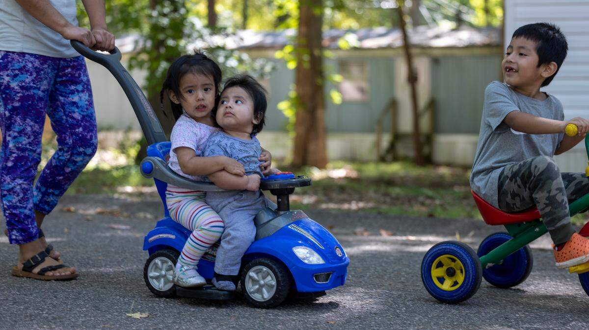 Residents of Chatham Estates mobile home park out for a morning walk through their neighborhood on Friday, September 15, 2023 in Cary, N.C.