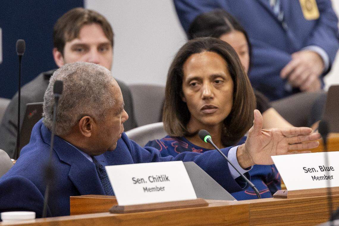 Sen. Dan Blue, a Raleigh Democrat and former longtime Senate Democratic leader, left, talks with Sen. Sydney Batch, right, a Wake County Democrat who was elected leader by their party’s caucus this 2025 legislative session.