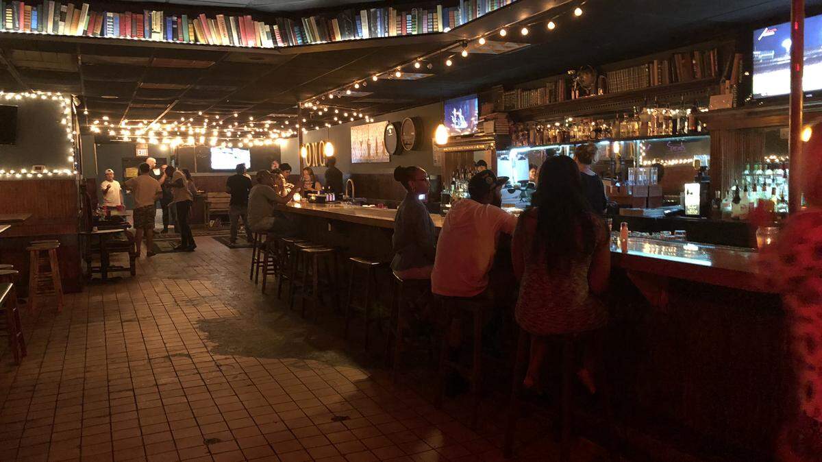 The bar area where patrons can order drinks or hang out at The Library.