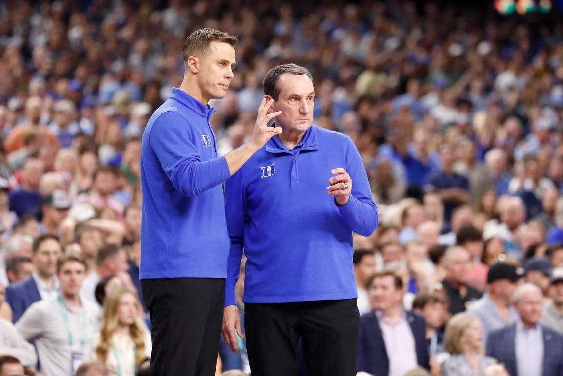 Duke head coach Mike Krzyzewski and associate head coach Jon Scheyer talk during the second half of UNC’s 81-77 victory over Duke in the Final Four at Caesars Superdome in New Orleans, La., Saturday, April 2, 2022.