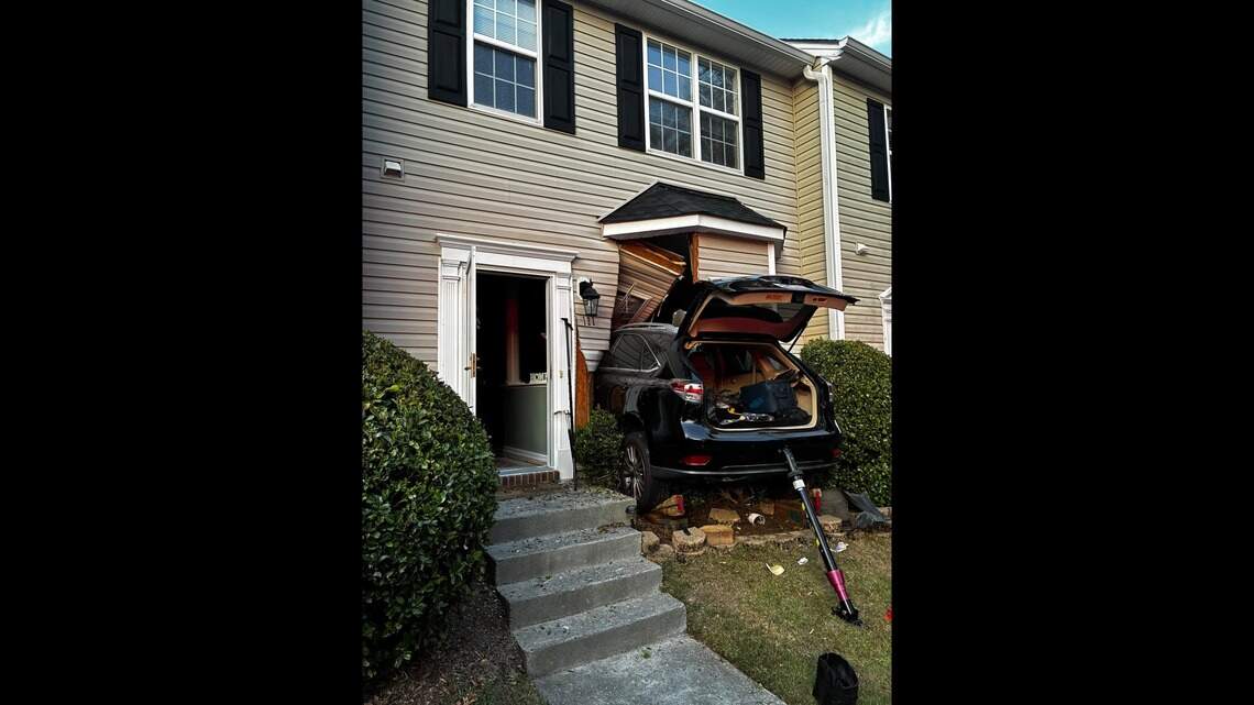 Wake County couple crashes car into the front of their house, officials say