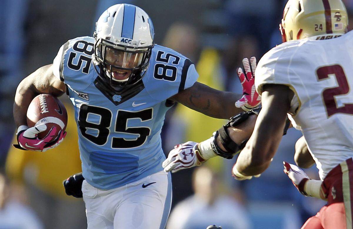 UNC’s Eric Ebron runs past Boston College’s Kevin Pierre-Louis during North Carolina’s 34-10 victory at Kenan Memorial Stadium on October 26, 2013 in Chapel Hill, N.C.