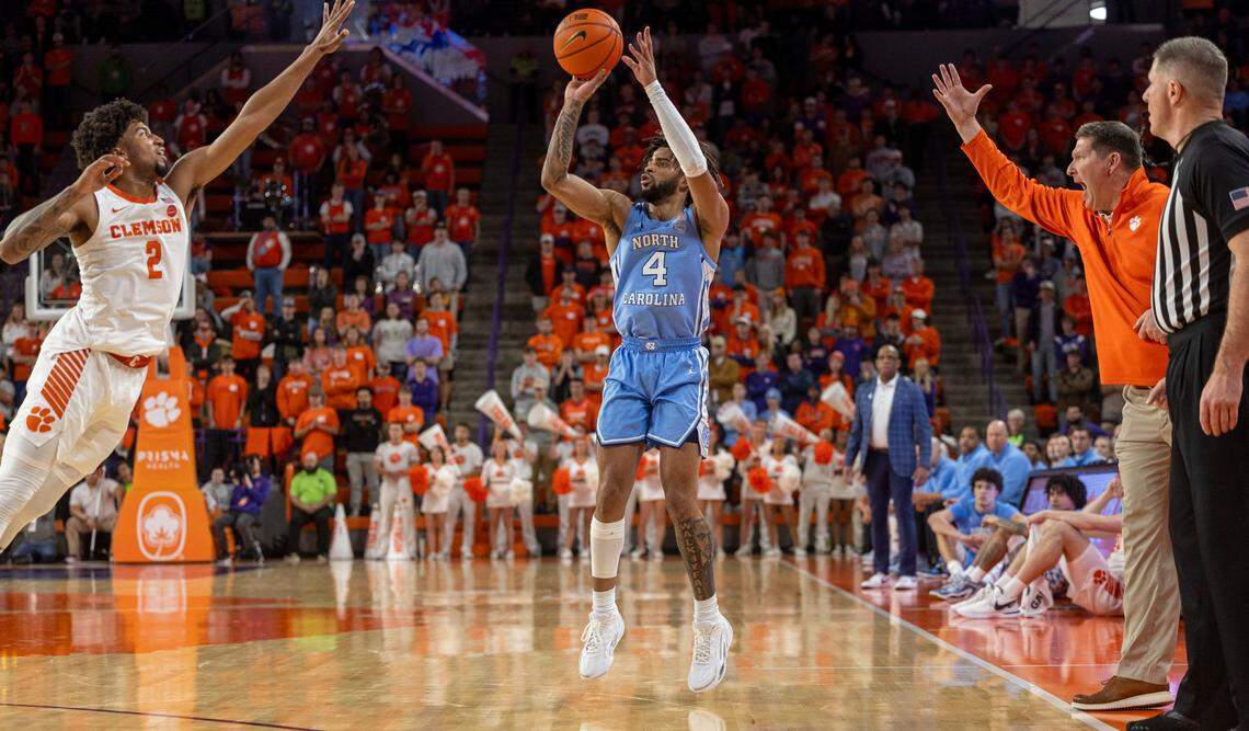North Carolina’s R.J. Davis (4) launches a three point shot against Clemson’s Dillon Hunter (2) in the first half on Saturday, January 6, 2024 at Littlejohn Coliseum in Clemson, S.C. Davis scored 14 points in the Tar Heels’ 65-55 victory.