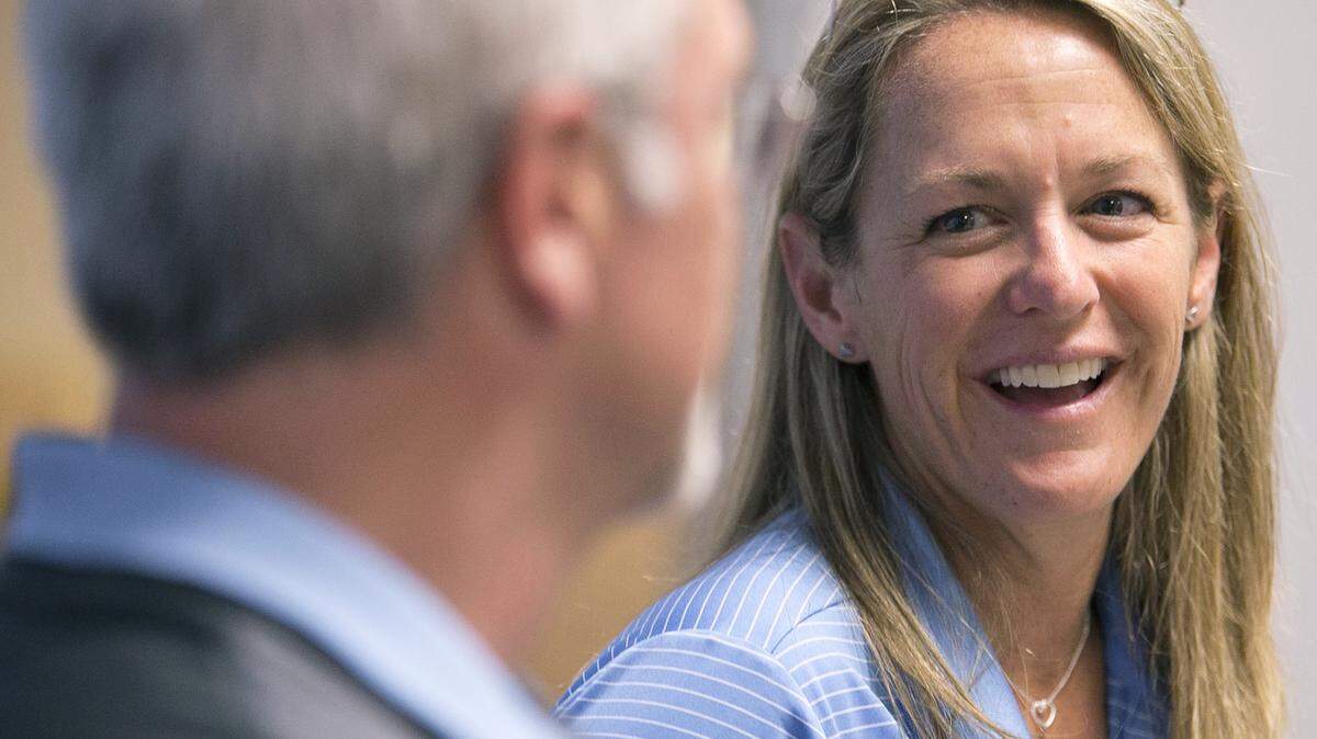 North Carolina women’s lacrosse coach Jenny Levy smiles at North Carolina men’s lacrosse coach Joe Breschi during a press conference together where both coaches talked about winning dual NCAA National Championships on Tuesday, May 31, 2016 at Kenan Stadium in Chapel Hill, N.C.