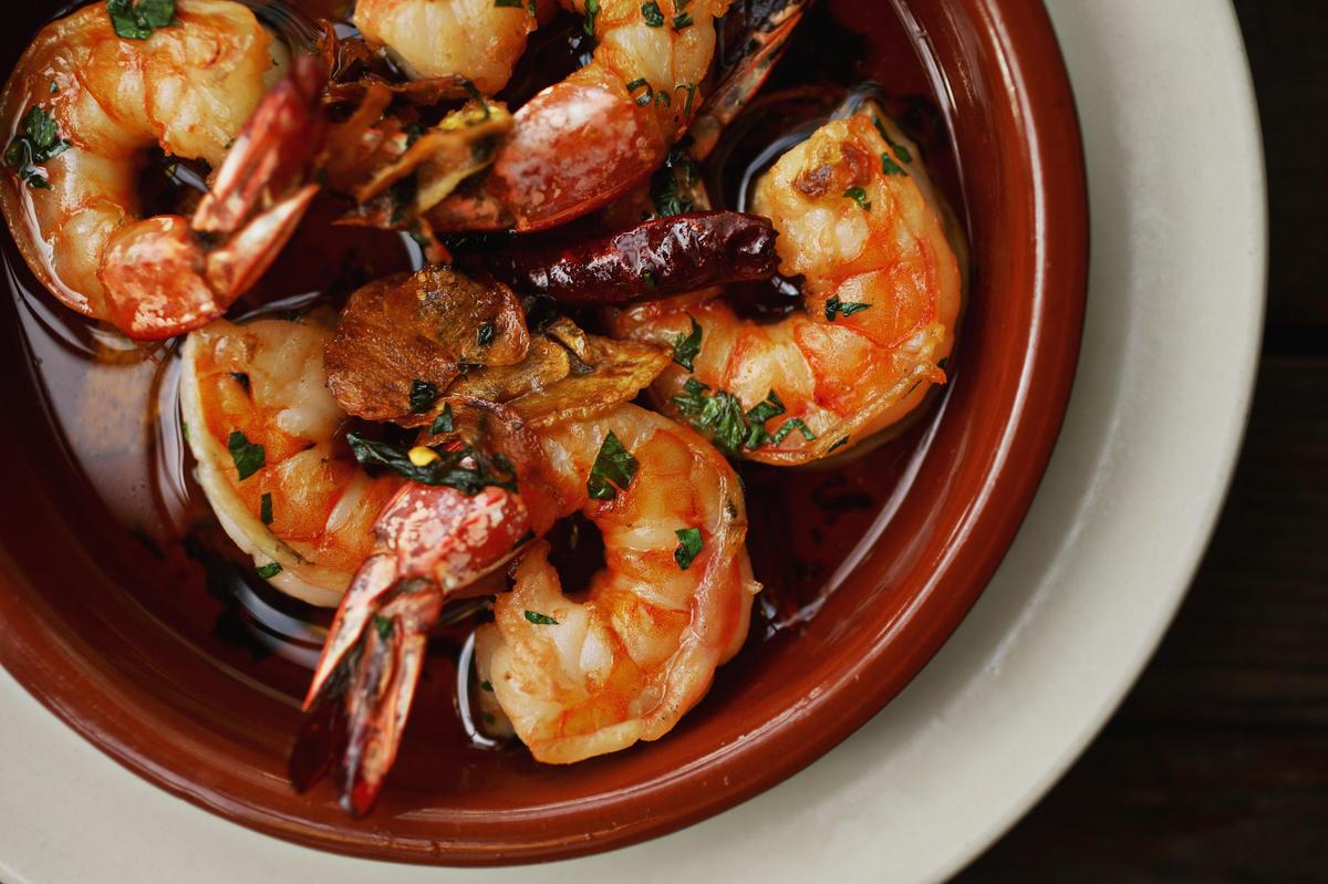 Gambas al ajillo, shrimp in olive oil punctuated with guindilla pepper, at Barcelona Wine Bar in downtown Raleigh.