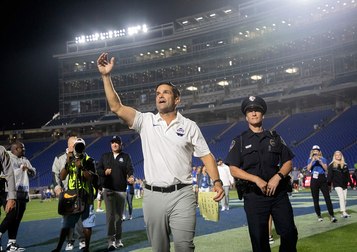 Duke head coach Manny Diaz waves to fans as he walks off the field following the Blue Devils’ 26-3 win over Elon on Friday, Aug. 30, 2024, at Wallace Wade Stadium in Durham, N.C.