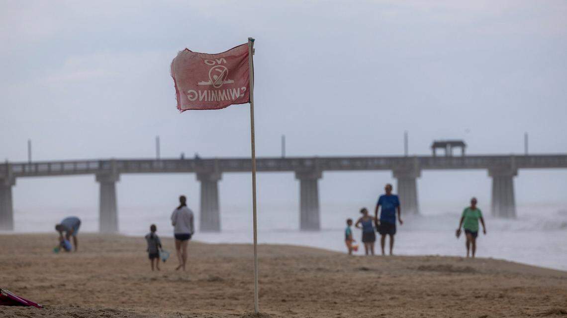“No Swimming” flags fly Wednesday, Sept. 13, 2023 in Nags Head NC as Hurricane Lee churns on a Northward track hundreds of miles offshore in the Atlantic. 