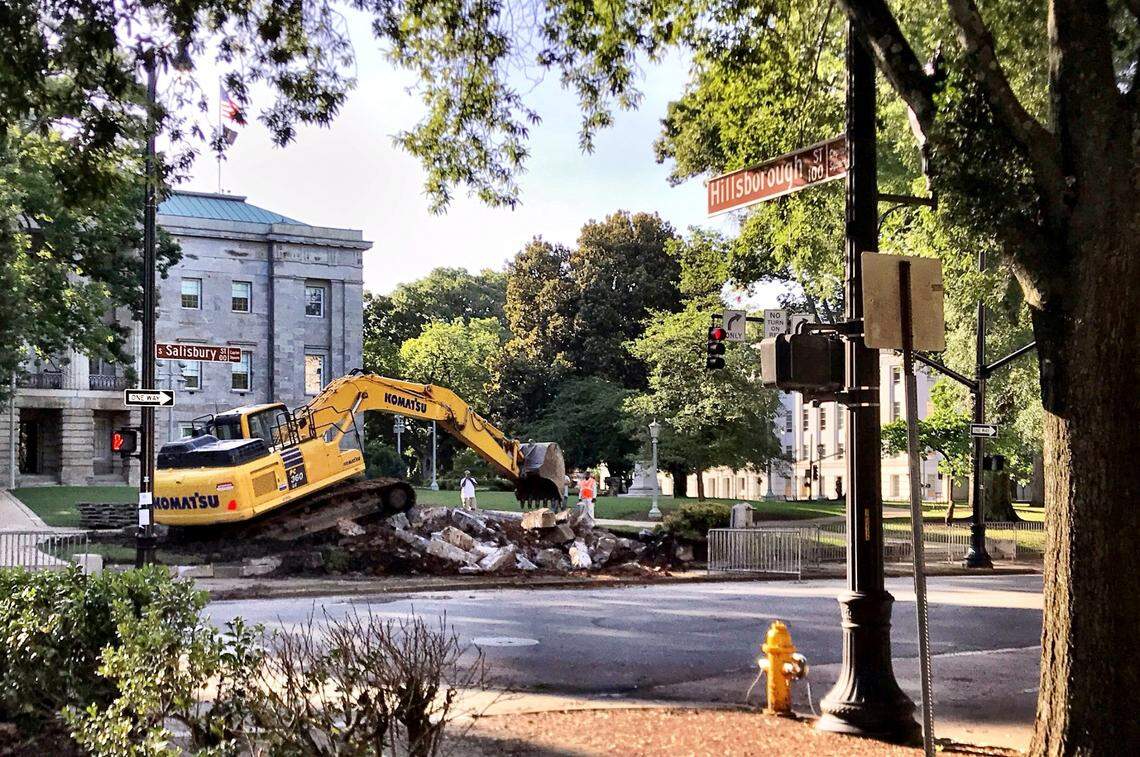 Crews remove the base of the Confederate memorial in Raleigh, North Carolina on June 29, 2020. The monument stood on the Capitol grounds for 125 years and was ordered removed by Gov. Roy Cooper for public safety reasons. Other parts of the monument were removed by both protesters and crews June 19 through June 24.