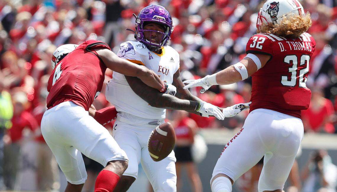 N.C. State’s Nick McCloud (4), left, and Drake Thomas (32) break up a pass intended for East Carolina wide receiver Leroy Henley (10) during the Wolfpack’s 34-6 victory over the Pirates in Raleigh in 2019.