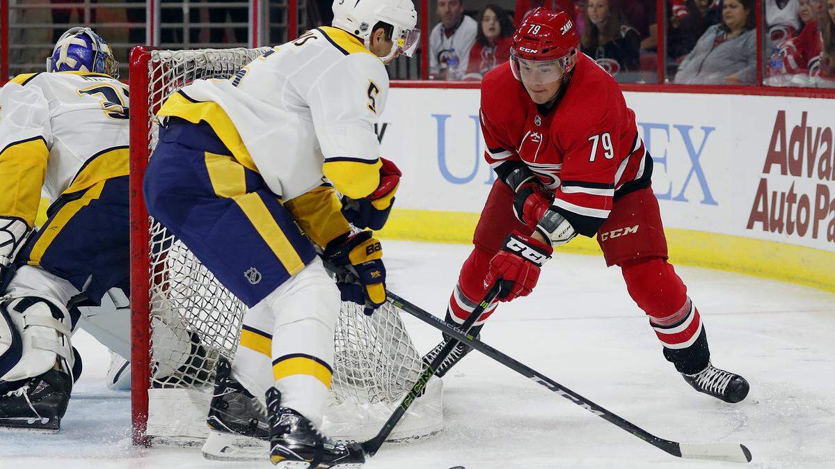 Carolina Hurricanes’ Micheal Ferland (79) battles for the puck against Nashville Predators in preseason game Sept. 30, 2018. (AP Photo/Karl B DeBlaker)