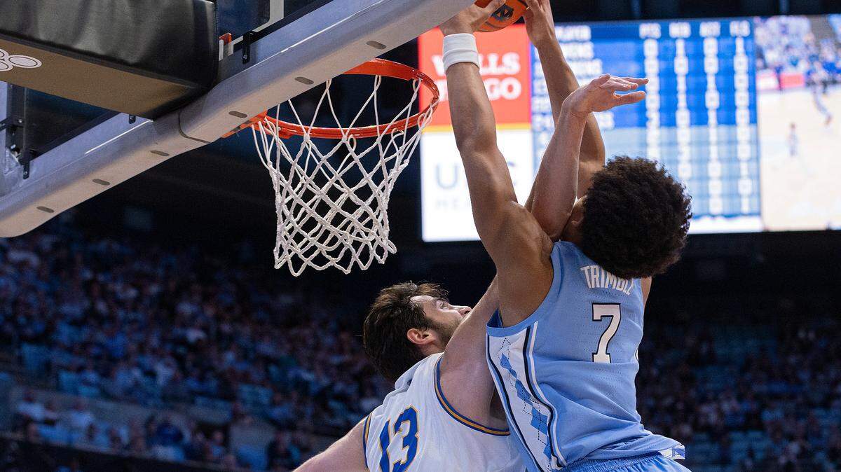 North Carolina’s Seth Trimble dunks over UC Riverside’s Vladimer Salaridze during the first half of the Tar Heels’ game on Friday, Nov. 17, 2023, at the Smith Center in Chapel Hill, N.C.