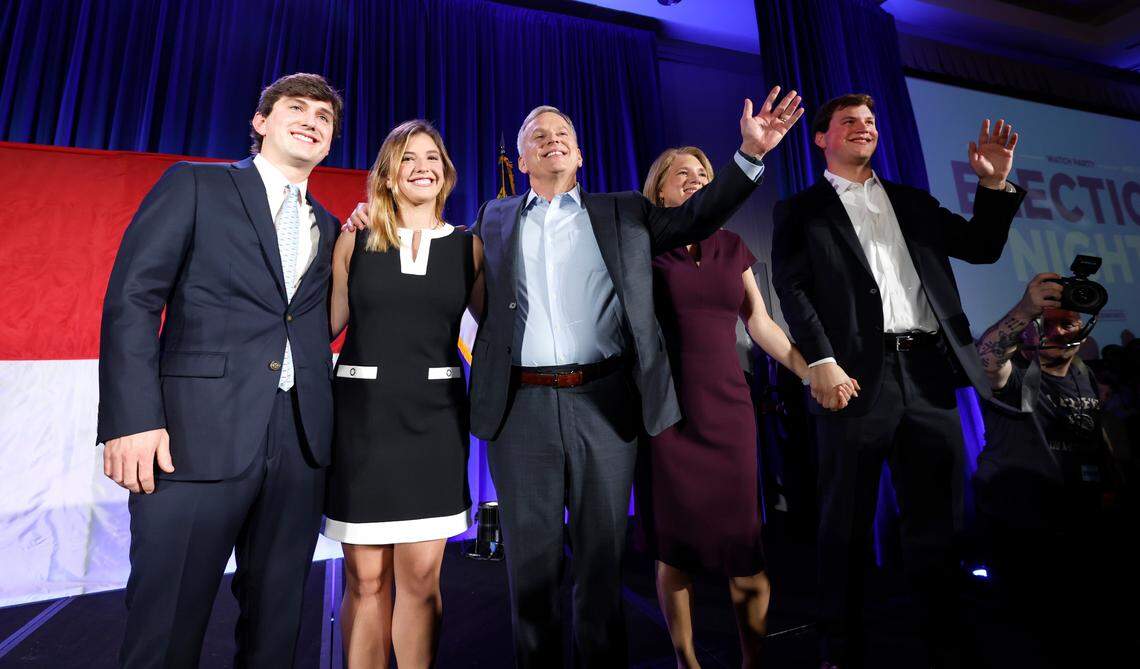 Governor-elect Josh Stein and his family, from left, Sam, Leah, wife Anna and Adam acknowledge the crowd after Stein spoke during a North Carolina Democratic Party election night event at the Marriott City Center in Raleigh, N.C., Tuesday, Nov. 5, 2024. 