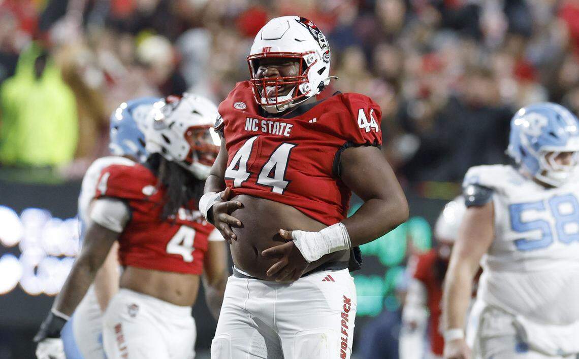 N.C. State defensive tackle Brandon Cleveland (44) celebrates after sacking North Carolina quarterback Gio Lopez during the first half of N.C. State’s game against UNC at Carter-Finley Stadium in Raleigh, N.C., Saturday, Nov. 29, 2025.