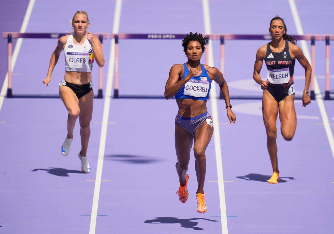 Aug 4, 2024; Paris, FRANCE; Anna Cockrell (USA) races Lina Nielsen (GBR) and Hanne Claes (BEL) in women’s 400m hurdles round 1 heats during the Paris 2024 Olympic Summer Games at Stade de France.