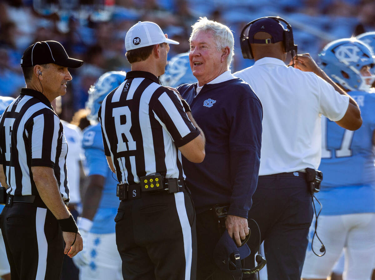 North Carolina coach Mack Brown has a word with referee Kevin Randall as a play is reviewed in the third quarter against Charlotte on Saturday, September 7, 2024 at Kenan Stadium in Chapel Hill, N.C.