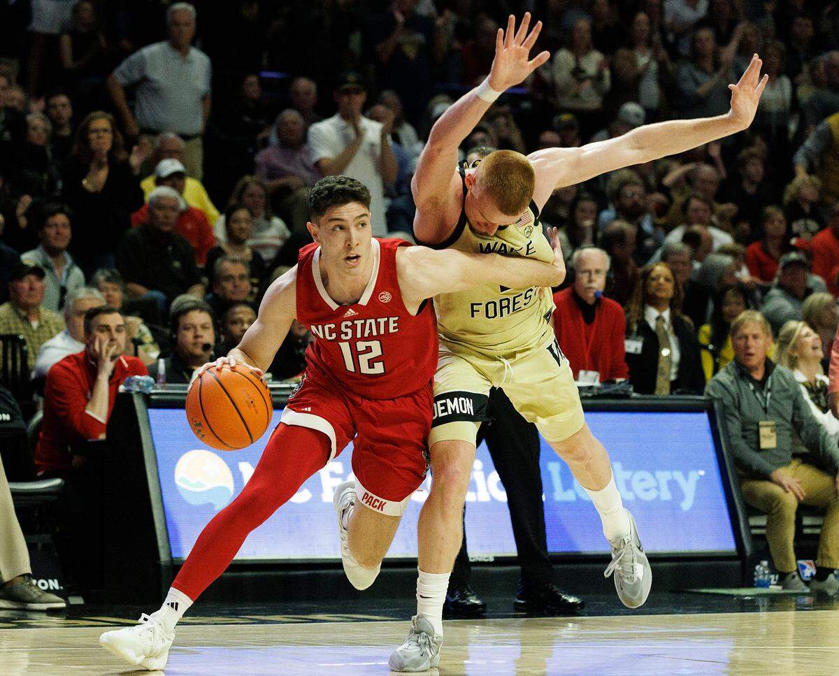N.C. State’s Michael O’Connell drives past Wake Forest’s Cameron Hildreth during the second half of the Wolfpack’s 83-79 loss on Saturday, Feb. 10, 2024, at Lawrence Joel Veterans Memorial Coliseum in Winston-Salem, N.C.