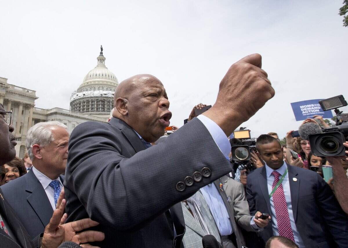 Rep. John Lewis, D-Ga., center, accompanied by fellow House Democrats, from left, House Assistant Minority Leader James Clyburn of S.C. Rep. Steve Israel, D-N.Y., and others, speaks on Capitol,Hill in Washington, Thursday, June 23, 2016, after House Democrats ended their sit-in protest.