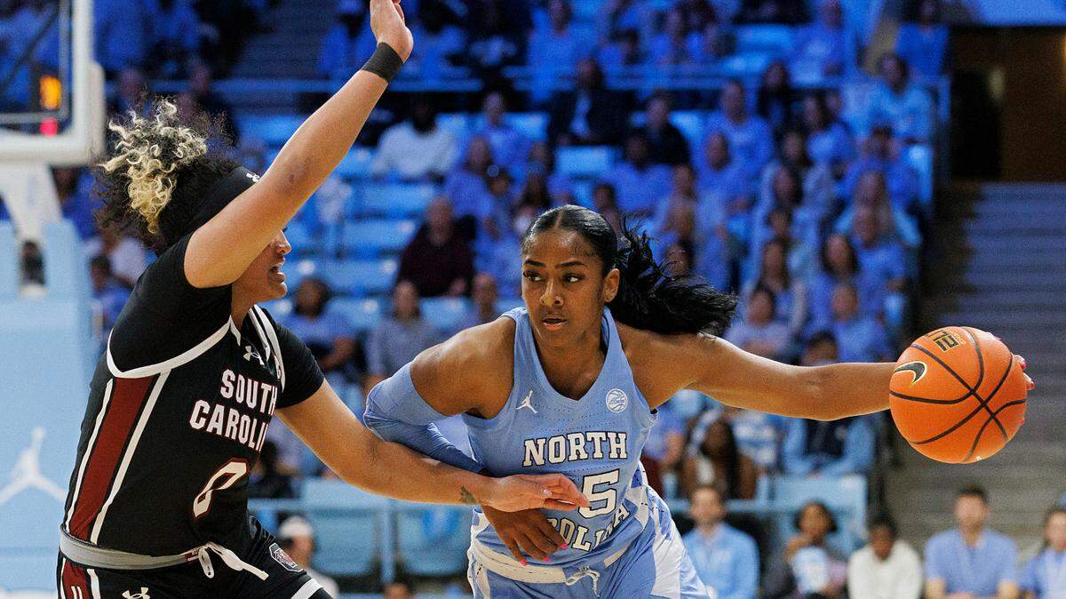 North Carolina’s Deja Kelly drives past South Carolina’s Te-Hina Paopao during the first half of the Tar Heels’ 65-58 loss on Thursday, Nov. 30, 2023, at Carmichael Arena in Chapel Hill, N.C.