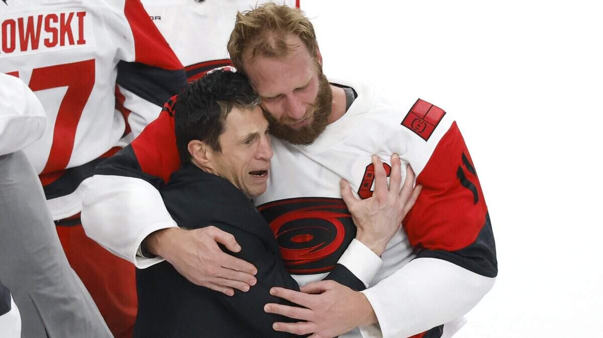 Canes coach Rod Brind'Amour and Jordan Staal (11) hug after the Hurricanes’ 3-0 victory over the Vegas Golden Knights to win the Stanley Cup at T-Mobile Arena in Las Vegas, Nev., Sunday, June 14, 2026.