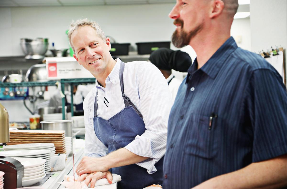Hawthorne & Wood owner/chef Brandon Sharp, left, laughs with general manager Neal Benefield in the Chapel Hill kitchen at the start of dinner service on Tuesday evening, Oct. 22, 2019.