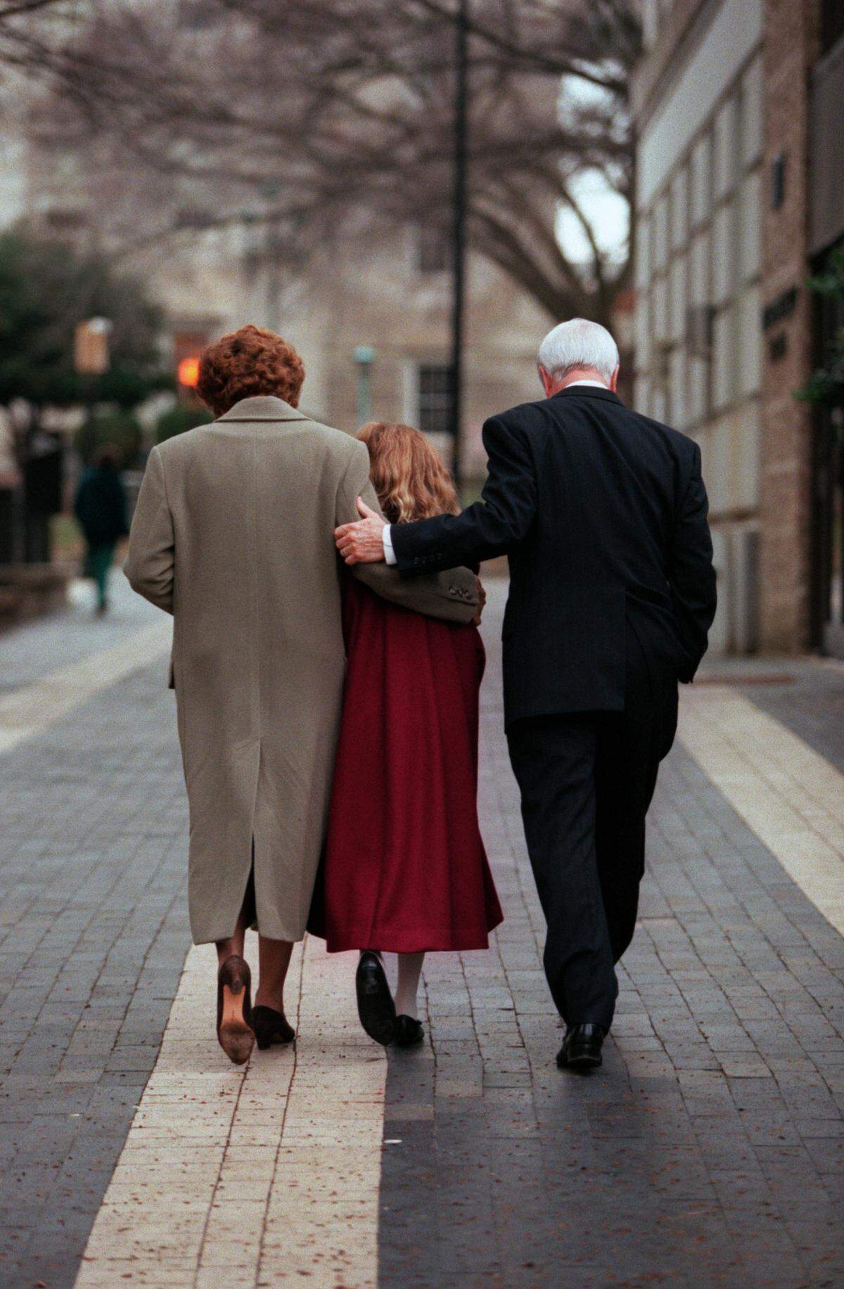 Governor Jim Hunt walks back to the capital with his wife Carolyn and granddaughter Hannah after handing in paperwork announcing his candidacy for governorship at the Board of Elections in 1996.