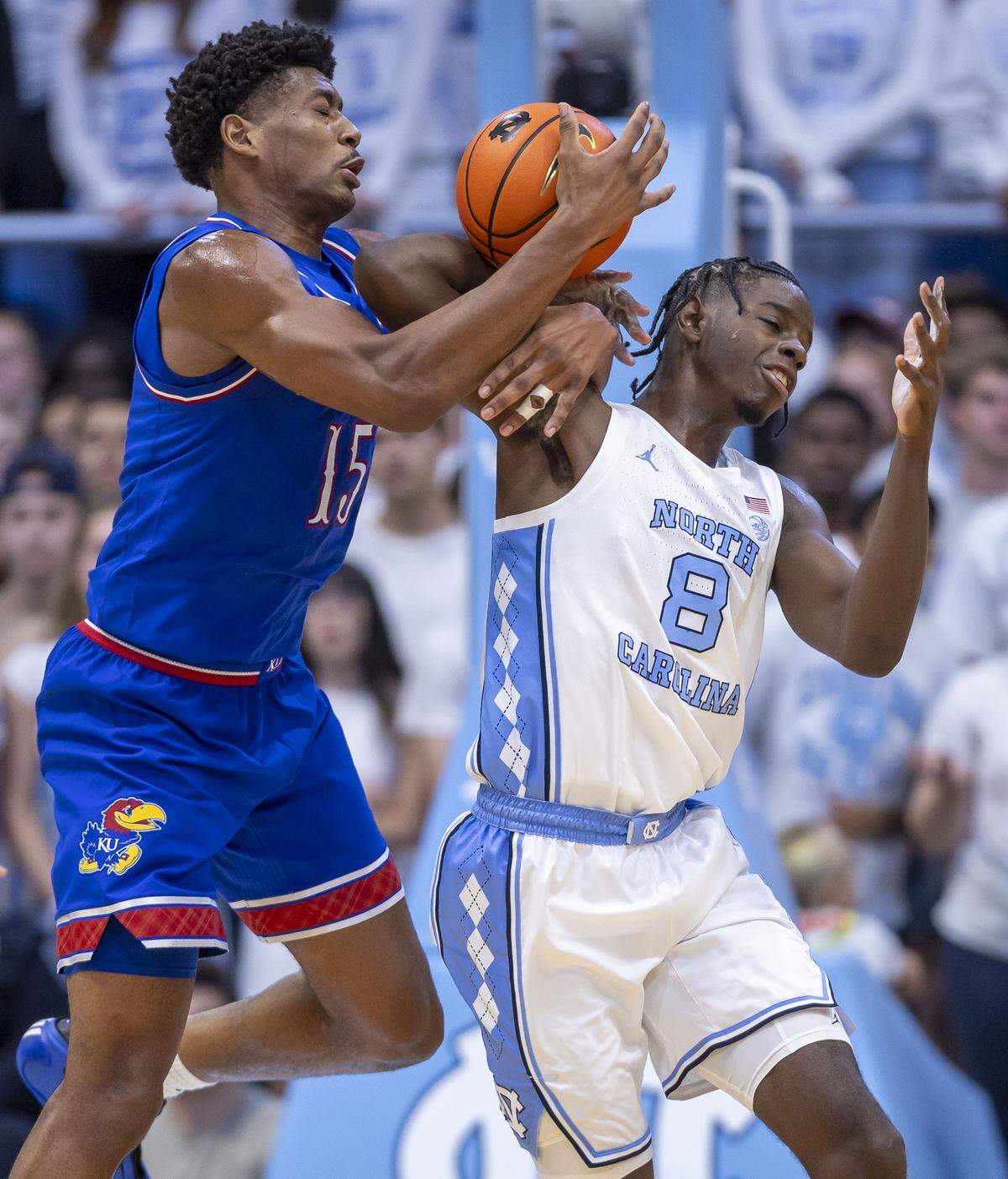 Kansas forward Bryson Tiller (15) tries for a steal from North Carolina forward Caleb Wilson (8) in the first half on Friday, November 7, 2025 at the Smith Center in Chapel Hill, N.C.