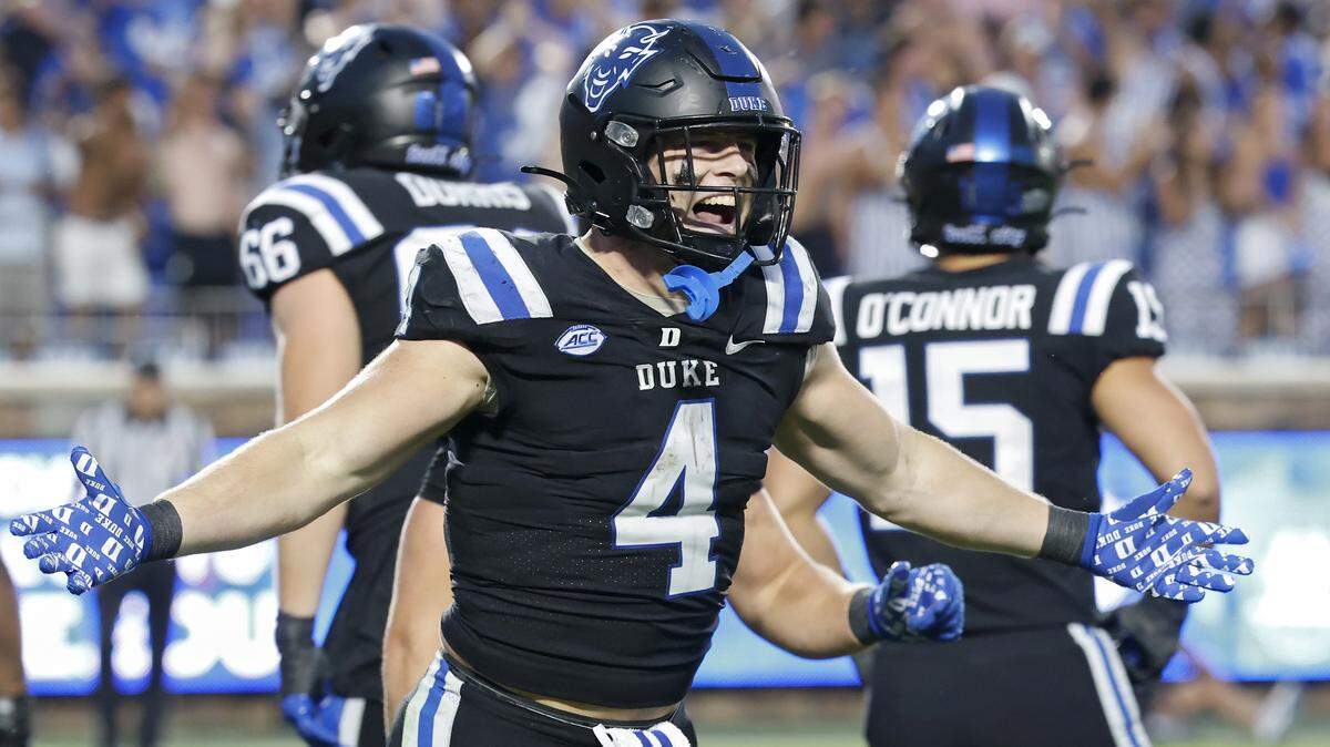 Duke’s Anderson Castle celebrates after scoring a touchdown late in the fourth quarter of the Blue Devils’ win over N.C. State on Saturday at Wallace Wade Stadium in Durham.