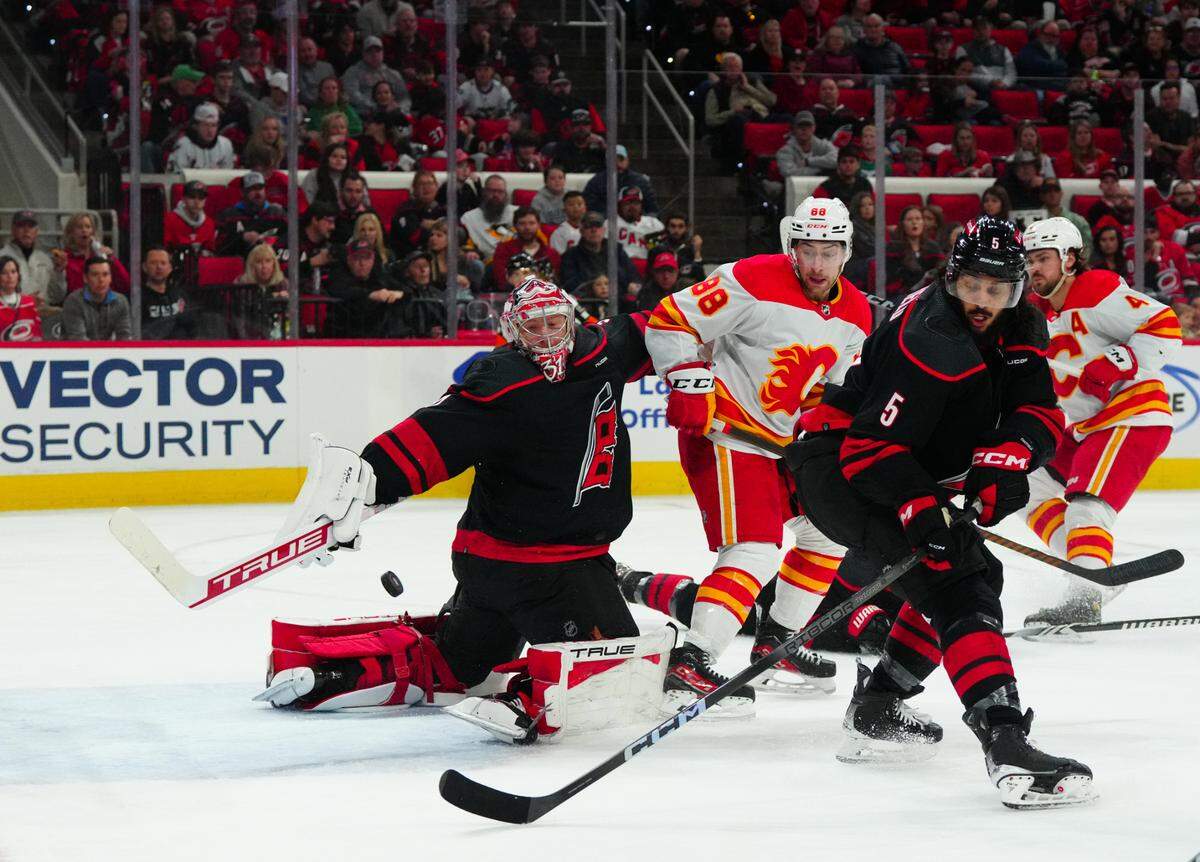 Carolina Hurricanes goaltender Frederik Andersen (31) reaches back to make a stick save against the Calgary Flames during the second period at PNC Arena.