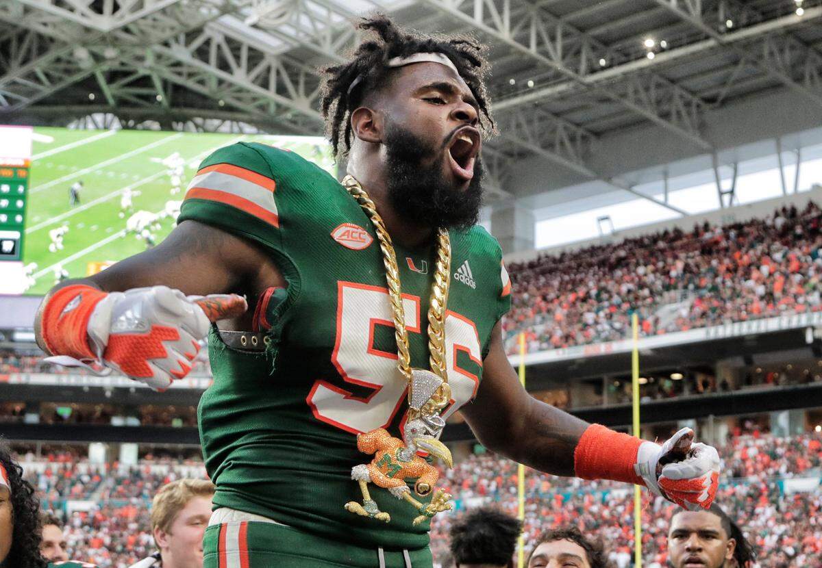 Miami linebacker Michael Pinckney celebrates with the turnover chain during the second half of an NCAA college football game against Florida State, Saturday, Oct. 6, 2018, in Miami Gardens, Fla. Miami won 28-27. 