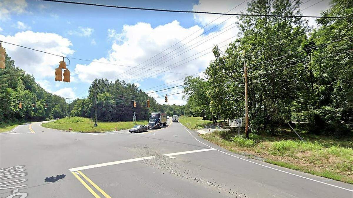 This undeveloped parcel (center left) at the intersection of NC 86 and US 70A in Hillsborough is being developed for a mix of retail, restaurants and office uses. Hillsborough Self-Storage and the Leland Little auction house (at right) are located across the street.