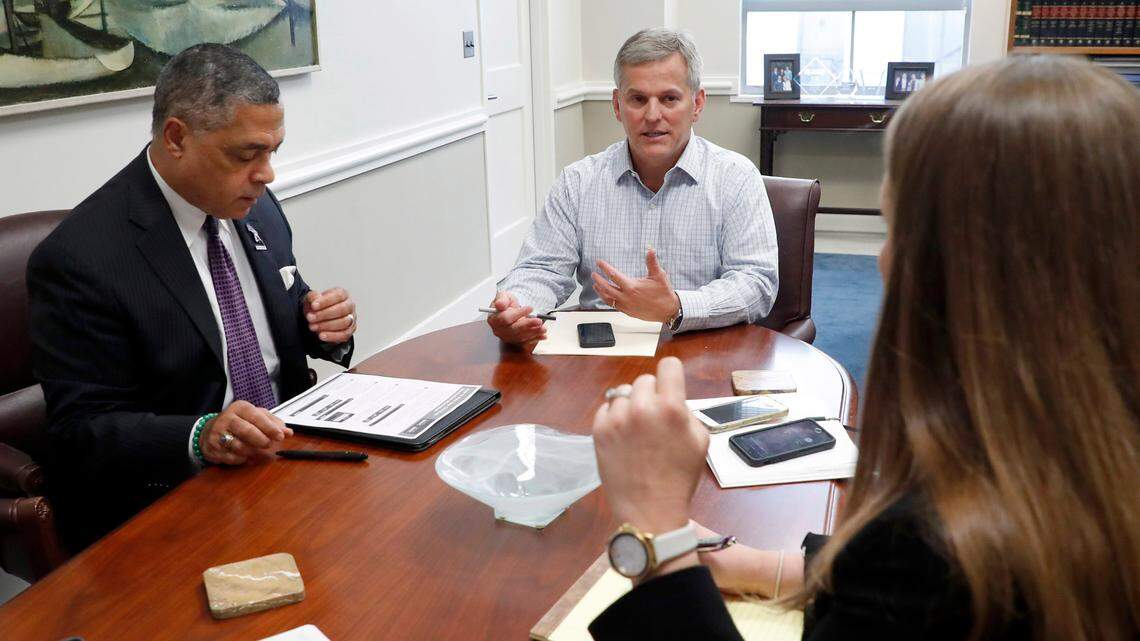 North Carolina Attorney General Josh Stein, center, meets with top aides including criminal bureau chief Leslie Cooley Dismukes, right, and civil bureau chief Reuben Young in Raleigh, N.C. Thursday, July 29, 2021.