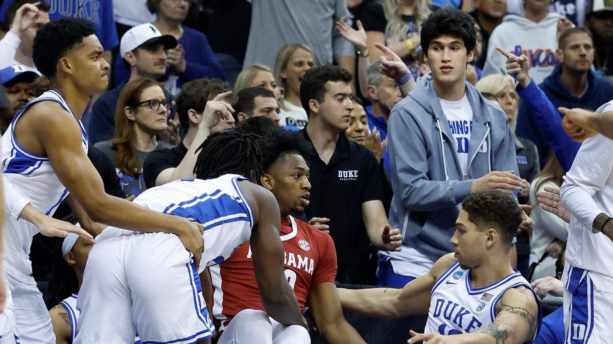 Duke’s Stanley Borden, right, watches after Duke’s Sion James and Alabama’s Mouhamed Dioubate got tangled up chasing a loose ball during Duke’s 85-65 victory in their Elite Eight game in the 2025 NCAA Men’s Basketball Championship at the Prudential Center in Newark, N.J., Saturday, March 29, 2025.