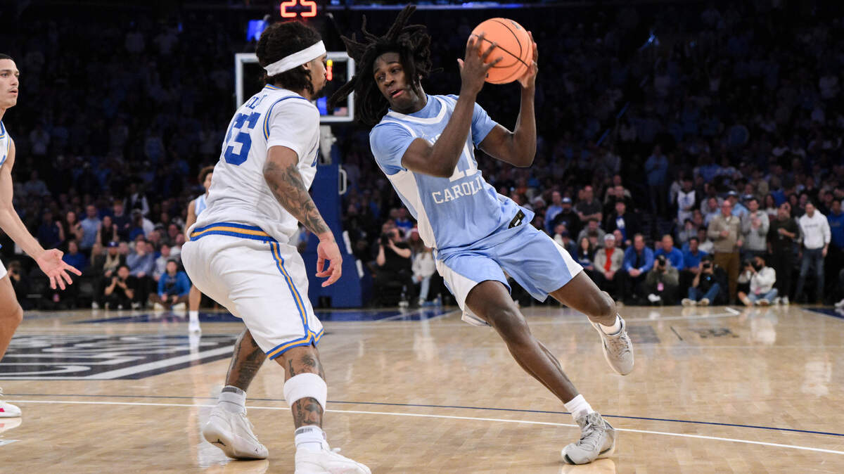 North Carolina Tar Heels guard Ian Jackson (11) drives to the basket while being defended by UCLA Bruins guard Skyy Clark (55) during the second half at Madison Square Garden.