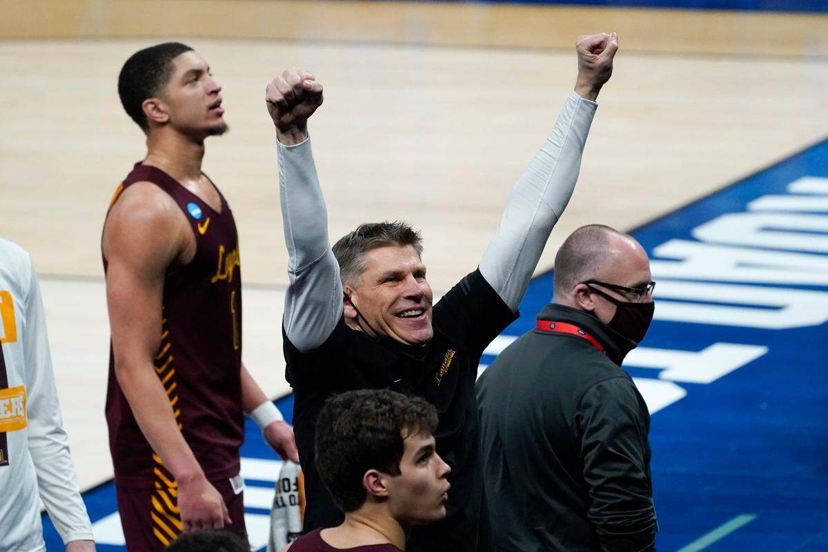 Loyola Chicago head coach Porter Moser celebrates beating Illinois 71-58 after a men’s college basketball game in the second round of the NCAA tournament at Bankers Life Fieldhouse in Indianapolis, Sunday, March 21, 2021.