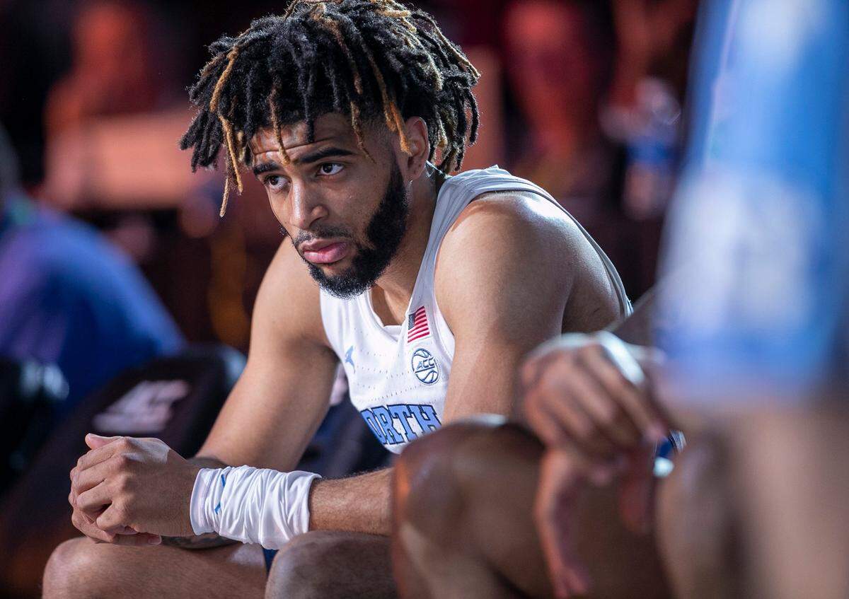 North Carolina’s R.J. Davis (4) listens to coach Hubert Davis during the second round of the ACC Tournament on Wednesday, March 8, 2023 at the Greensboro Coliseum in Greensboro, N.C.