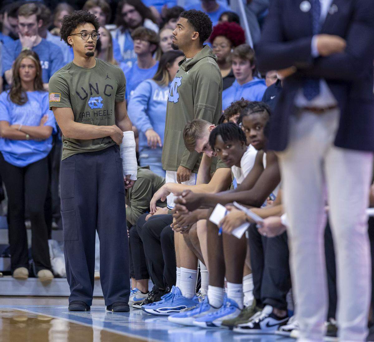 North Carolina guard Seth Trimble (7) takes a place at the end of the bench as he recovers from an injury, during the Tar Heels’ game against Radford on Tuesday, November 11, 2025 at the Smith Center in Chapel Hill, N.C. Trimble will not play for several weeka after breaking a bone in his left arm.