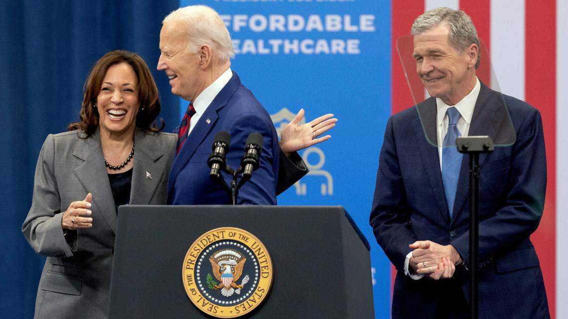 Gov. Roy Cooper (right) looks on as Vice President Kamala Harris welcomes President Joe Biden to the stage earlier this year in Raleigh. On July 21, Biden announced he would not to run for reelection.