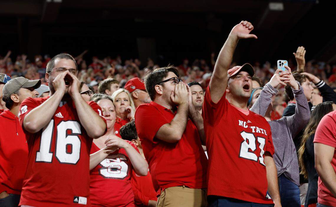 Wolfpack fans react to the pass interference call on N.C. State linebacker Drake Thomas during Boston College’s final drive during Boston College’s 21-20 victory over N.C. State at Carter-Finley Stadium in Raleigh, N.C., Saturday, Nov. 12, 2022.