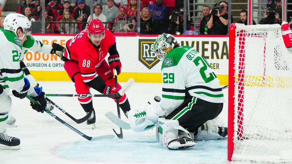 Dallas Stars goaltender Jake Oettinger (29) stops the scoring attempt by Carolina Hurricanes center Martin Necas (88) during the first period at PNC Arena.