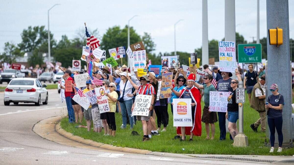 More than 1500 demonstrators lined Capital Boulevard to protest the policies and tactics of the of President Donald Trump on Saturday, June 14, 2025 near Triangle Town Center in Raleigh. The Raleigh “No Kings” rally was one of dozens across North Carolina and hundreds nationwide on what organizers called a nationwide day of defiance against the Trump administration.