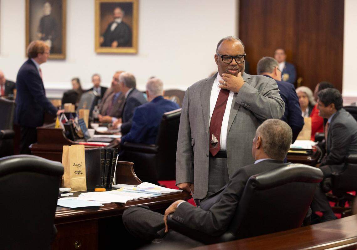 Rep. Paul Lowe Jr. of Forsyth County talks with Senator Dan Blue of Wake County during debate of Senate Bill 758, which redraws the North Carolina Senate districts, on Tuesday, October 24, 2023 at the General Assembly in Raleigh, N.C.