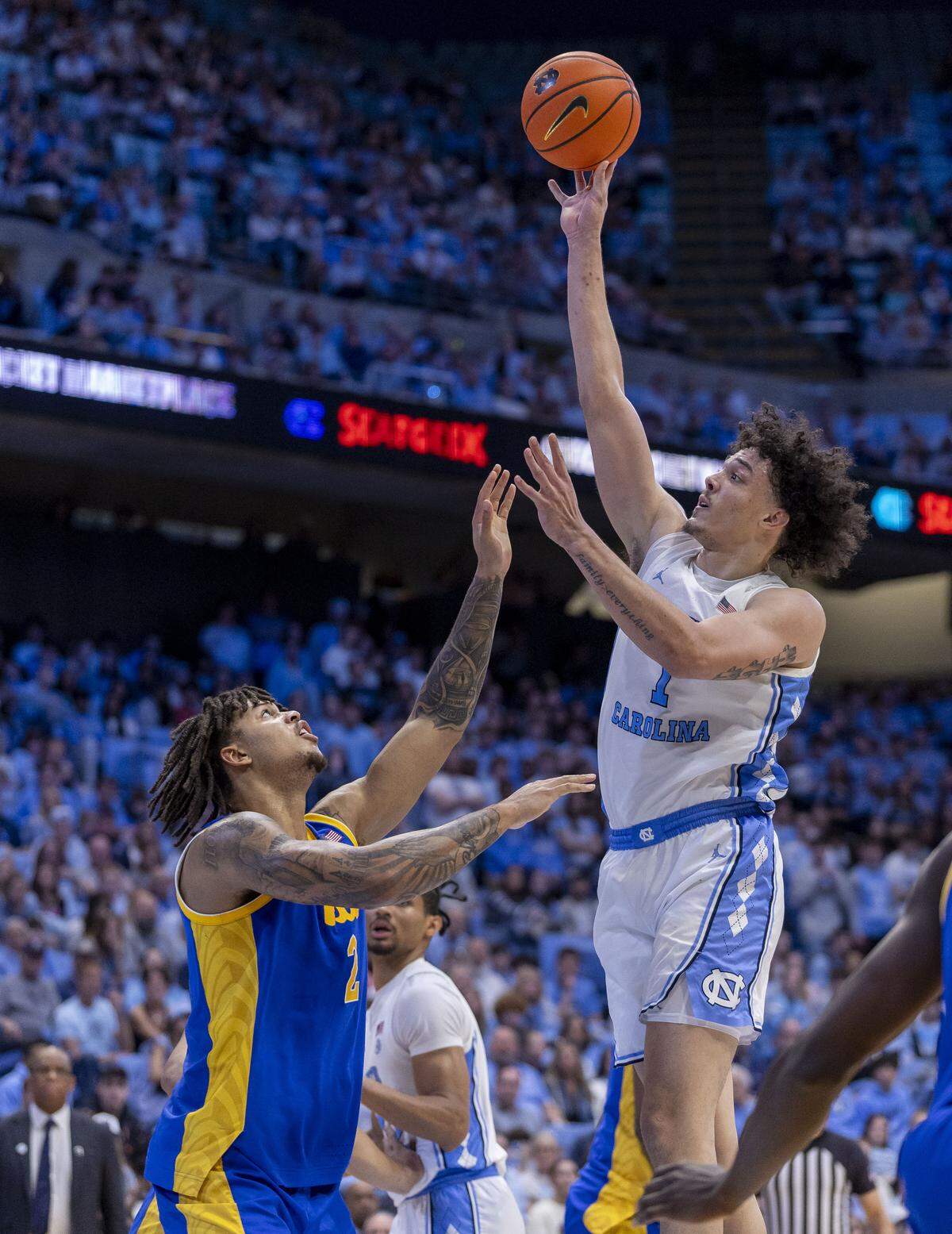 North Carolina center Zayden High (1) puts up a shot against Pitt forward Cameron Corhen (2) in the second half on Saturday, February 14, 2026 at the Smith Center in Chapel Hill, N.C. High scored 15 points in the Tar Heels’ victory.