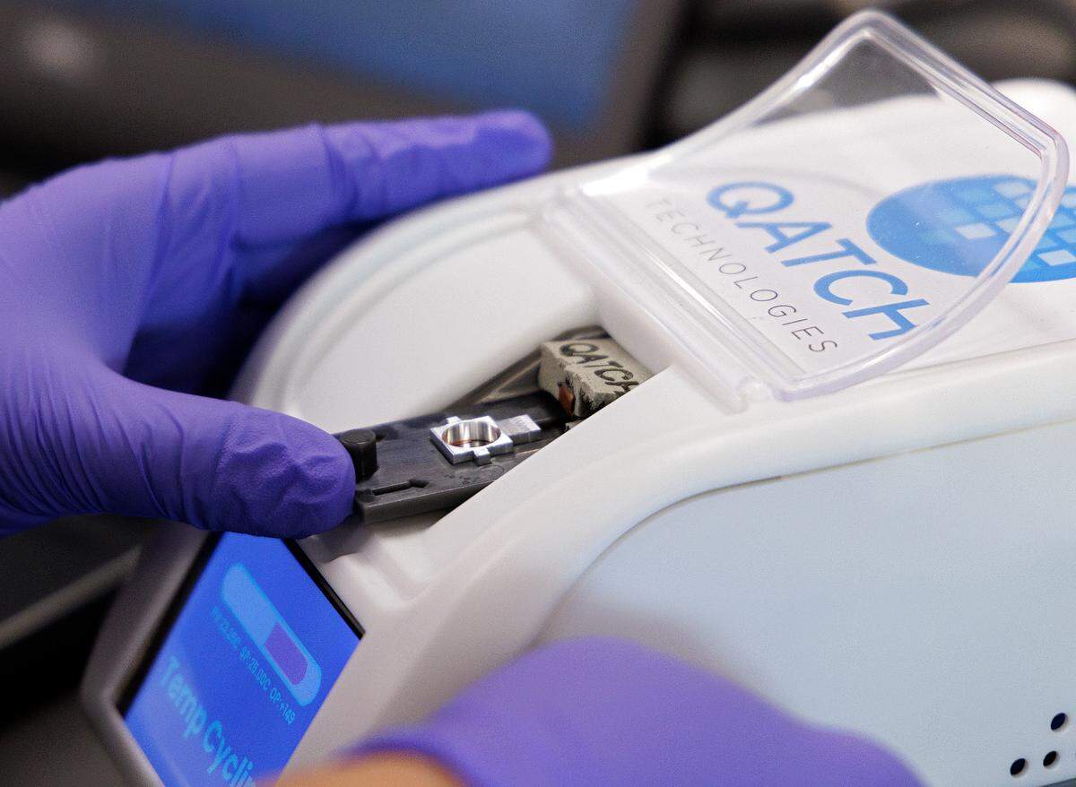 Zehra Parlak, founder of Qatch Technologies, works in the company’s laboratory space to test sensors used to measure the viscosity of drugs on Friday, Dec. 8, 2023, in Durham, N.C.