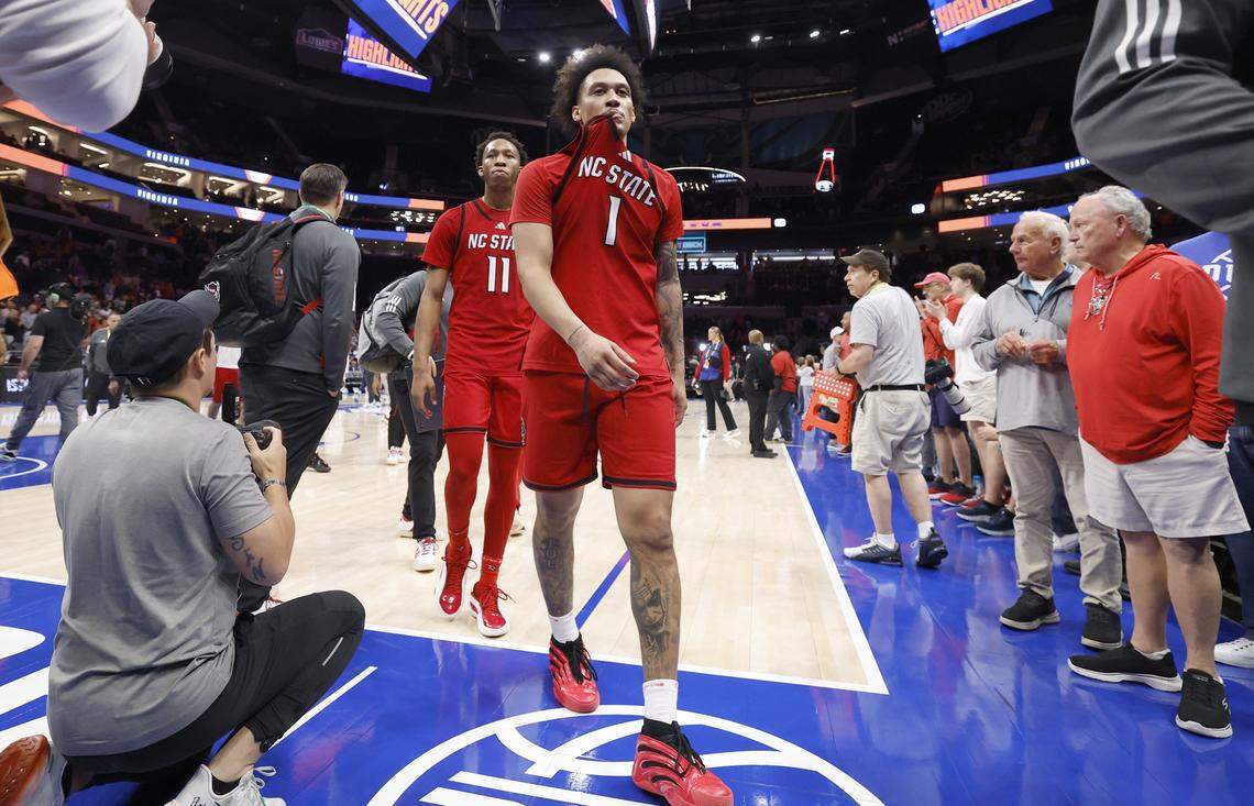 N.C. State's Darrion Williams (1) and Quadir Copeland (11) walk off the court after Virginia’s 81-74 victory over N.C. State in the quarterfinals of the 2026 ACC Men’s Basketball Tournament at the Spectrum Center in Charlotte, N.C., Thursday, March 12, 2026.